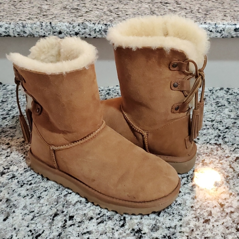 Authentic UGG fuzzy boots with tassels